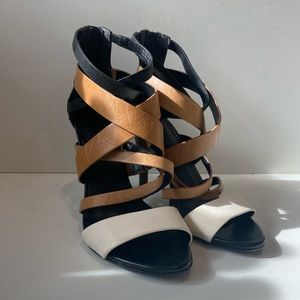 Vera Wang strappy heel. Black, tan and white in a size 6.5. Like new condition.